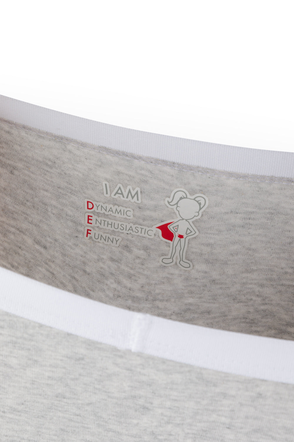 Gray girls underwear with inspirational text and a graphic on a white background